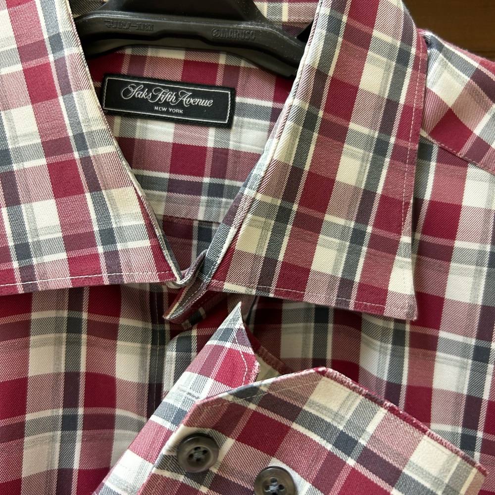 Like New, worn once and dry cleaned. Saks button down.